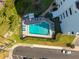 Aerial view of a community pool with lounge chairs and well-maintained landscaping at 30 Turner St # 604, Clearwater, FL 33756