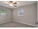 Bright bedroom with fresh paint, new carpet, and natural light from two windows at 3003 E 27Th Ave, Tampa, FL 33605