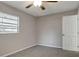 Freshly painted bedroom with neutral tones, window with blinds, closet, and ceiling fan at 3003 E 27Th Ave, Tampa, FL 33605