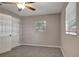 Bedroom featuring a window with blinds, ceiling fan, and a closet for storage and fresh paint at 3003 E 27Th Ave, Tampa, FL 33605