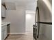 Modern kitchen with stainless steel appliances, updated gray cabinetry, and pristine countertops at 3003 E 27Th Ave, Tampa, FL 33605