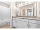 Bathroom featuring double sinks, granite countertops, and a tub/shower combo at 307 S Gomez Ave # 1, Tampa, FL 33609