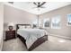 Bedroom featuring neutral walls, ceiling fan, and multiple windows for ample light at 307 S Gomez Ave # 1, Tampa, FL 33609