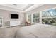Relaxing bedroom boasting natural light, large windows, and a calm, neutral color scheme at 307 S Gomez Ave # 1, Tampa, FL 33609
