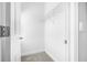 Empty white walk-in closet features carpeted floors and one wire shelving unit at 307 S Gomez Ave # 1, Tampa, FL 33609