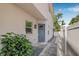 Covered entryway with a stylish front door and manicured landscaping at 307 S Gomez Ave # 1, Tampa, FL 33609