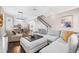 Open-concept living room and kitchen with a modern design, hardwood floors, and neutral color palette at 307 S Gomez Ave # 1, Tampa, FL 33609