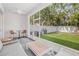 Screened-in lanai featuring a fan and putting green in the backyard at 307 S Gomez Ave # 1, Tampa, FL 33609