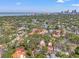 Aerial view of the property in a residential neighborhood with mature trees and water views at 356 22Nd Ne Ave, St Petersburg, FL 33704