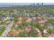 Aerial view of the property in a residential neighborhood with city views in the background at 356 22Nd Ne Ave, St Petersburg, FL 33704