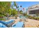 Inviting backyard retreat with beautiful brick patio, lounge seating, and colorful string lights, perfect for entertaining at 356 22Nd Ne Ave, St Petersburg, FL 33704