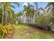 Spacious backyard featuring a well-maintained lawn and lush landscaping, showcasing the home's exterior at 356 22Nd Ne Ave, St Petersburg, FL 33704
