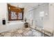 Bright bathroom featuring a tub with ornate wood surround, a glass enclosed shower, and an elegant patterned rug at 356 22Nd Ne Ave, St Petersburg, FL 33704