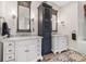 Bathroom with dual vanities, white cabinets, and unique decor at 356 22Nd Ne Ave, St Petersburg, FL 33704