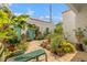 Inviting courtyard featuring a fountain, lush plants, outdoor seating, and charming stucco architecture at 356 22Nd Ne Ave, St Petersburg, FL 33704