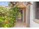 Charming courtyard with a brick pathway, lush greenery, and a glimpse of the inviting outdoor space beyond at 356 22Nd Ne Ave, St Petersburg, FL 33704