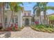 Stunning home with landscaped front yard, mature palms, and an inviting paver driveway at 356 22Nd Ne Ave, St Petersburg, FL 33704