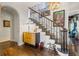 Elegant foyer with hardwood floors, a staircase, and decorative artwork at 356 22Nd Ne Ave, St Petersburg, FL 33704
