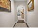 Hallway with unique archway, artwork, and hardwood flooring at 356 22Nd Ne Ave, St Petersburg, FL 33704