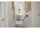 Well lit hallway with multiple art pieces hanging on the wall and carpet stairs at 356 22Nd Ne Ave, St Petersburg, FL 33704