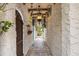Charming hallway features textured walls, brick flooring, and an array of decorative elements, creating a unique and inviting space at 356 22Nd Ne Ave, St Petersburg, FL 33704