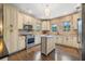 Well-lit kitchen boasts an island, stainless steel appliances, unique backsplash, and ample counter space at 356 22Nd Ne Ave, St Petersburg, FL 33704