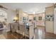 Spacious kitchen featuring a stylish island, hardwood floors, stainless steel appliances, and unique backsplash at 356 22Nd Ne Ave, St Petersburg, FL 33704