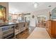 Spacious kitchen featuring a breakfast bar, modern lighting, and hardwood floors at 356 22Nd Ne Ave, St Petersburg, FL 33704