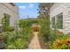 Beautifully landscaped walkway showcasing mature plants and charming architectural details at 356 22Nd Ne Ave, St Petersburg, FL 33704