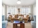 Inviting living room with white curtains, a decorative wall hanging, and comfortable seating at 356 22Nd Ne Ave, St Petersburg, FL 33704
