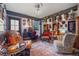 Cozy living room with hardwood floors, unique furnishings, and vintage decor, creating a warm and inviting atmosphere at 356 22Nd Ne Ave, St Petersburg, FL 33704