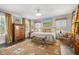 Bright and airy bedroom with a large bed, decorative rug, and classic furnishings at 356 22Nd Ne Ave, St Petersburg, FL 33704