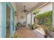 Inviting covered patio area with plants, decorative accents, and outdoor seating at 356 22Nd Ne Ave, St Petersburg, FL 33704
