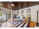 Cozy sun room with comfortable seating, striped rug, and natural light at 356 22Nd Ne Ave, St Petersburg, FL 33704