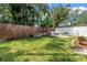 Lush backyard with grass and tropical plants at 3709 W Santiago St, Tampa, FL 33629