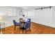 Bright dining area with modern table and chairs, wood floors, and natural light at 3709 W Santiago St, Tampa, FL 33629