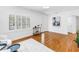Elegant living room with hardwood floors, stylish shutters, and natural light showcasing a cozy atmosphere at 3709 W Santiago St, Tampa, FL 33629