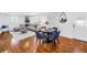 Inviting living room featuring a round dining table, wood floors, and comfortable seating area at 3709 W Santiago St, Tampa, FL 33629