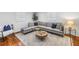 Spacious living room with a comfortable sectional, wood floors, and stylish decor at 3709 W Santiago St, Tampa, FL 33629