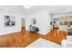 Bright living room with hardwood floors, stylish decor, and an open layout connecting to other rooms at 3709 W Santiago St, Tampa, FL 33629