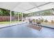 Relaxing screened porch with seating, offering a comfortable outdoor living space at 3709 W Santiago St, Tampa, FL 33629