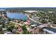 An aerial view of a waterfront home on the canal in a neighborhood with mature landscaping at 3931 Pompano Se Dr, St Petersburg, FL 33705