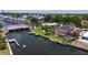 Breathtaking aerial view of the waterfront home, pool, dock, and boat lift at 3931 Pompano Se Dr, St Petersburg, FL 33705