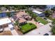 An aerial view of a luxurious Mediterranean-style home with a circular driveway and lush landscaping at 3931 Pompano Se Dr, St Petersburg, FL 33705