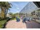 Relax by the fire pit overlooking the screened-in pool and waterfront at 3931 Pompano Se Dr, St Petersburg, FL 33705