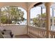 Spacious balcony with white columns, seating area, and views of the water at 3931 Pompano Se Dr, St Petersburg, FL 33705