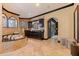 An elegant bathroom featuring a soaking tub, large vanity, and stylish arched mirrors at 3931 Pompano Se Dr, St Petersburg, FL 33705