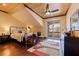 Bedroom with hardwood floors, vaulted ceiling, and access to screened porch with amazing view at 3931 Pompano Se Dr, St Petersburg, FL 33705