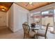 Dining area featuring a glass-top table, four chairs, and a view of the exterior at 3931 Pompano Se Dr, St Petersburg, FL 33705