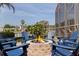 Cozy backyard seating area by the pool and waterfront views at 3931 Pompano Se Dr, St Petersburg, FL 33705